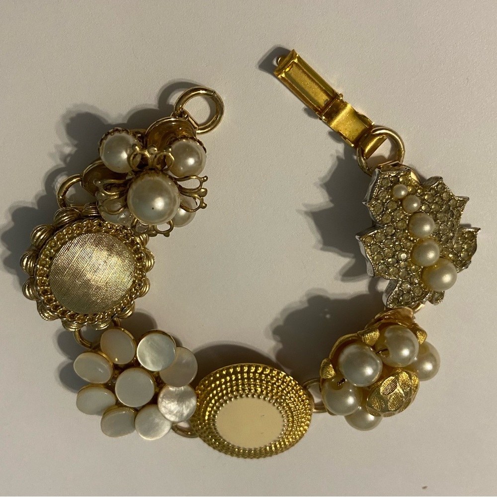 One of a kind bracelet made with vintage/antique earrings and brooches!
